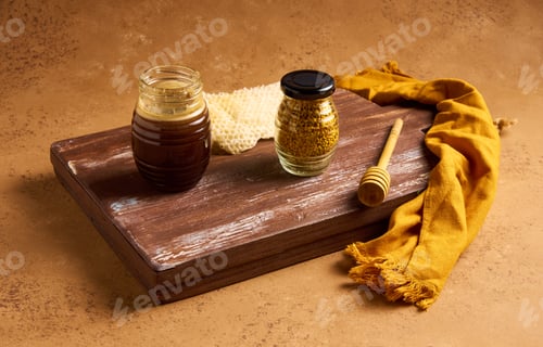 Preview: Still life of honey in a jar, honeycomb, pennyroyal and honey spoon