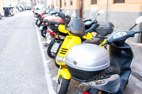 Preview: Lot of motor scooters parked in a row
