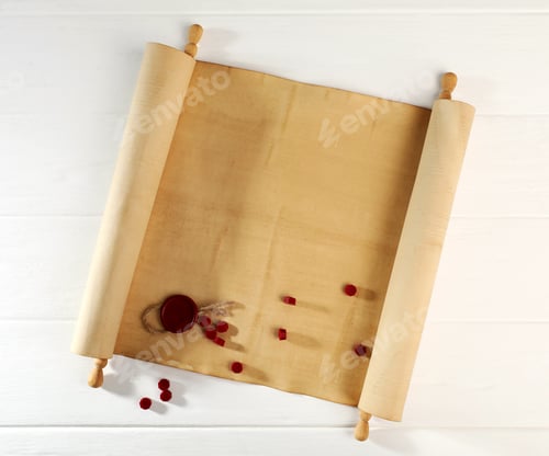 Preview: Scroll of old parchment paper with seal and wax beads on white wooden table, top view
