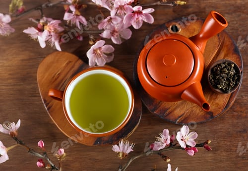 Preview: traditional green tea in a teapot and cup