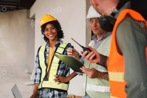 Preview: Engineer and Foreman builder team at construction site. American African foreman construction