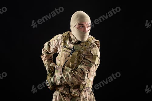 Preview: front view young soldier in uniform on black background tank warrior israel