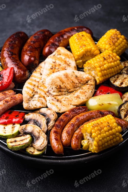 Preview: Grilled sausages, meat, and vegetables.