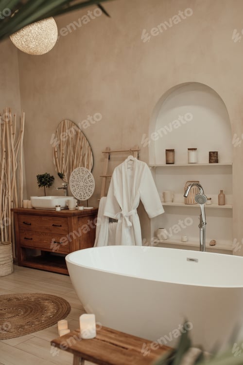 Preview: Luxury interior of big bathroom at modern african style with oval bathtub in natural lighting