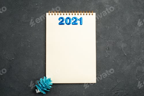 Preview: top view writing on notepad on dark background xmas new year photo color