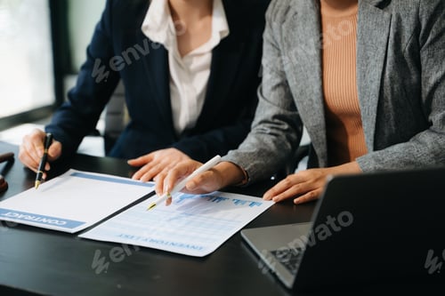Preview: Business and lawyers discussing contract papers with brass scale on desk in office. Law,