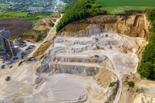 Preview: Open pit mining of construction sand stone materials with excavators and dump trucks.