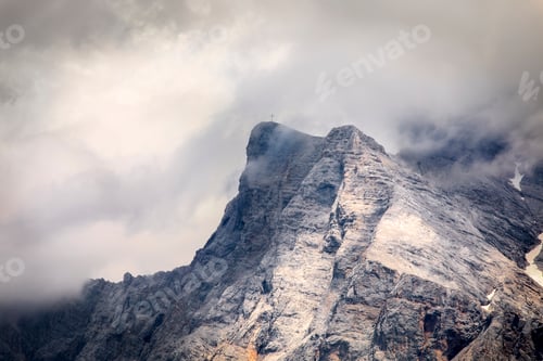 Preview: mountain rocky peak in clouds