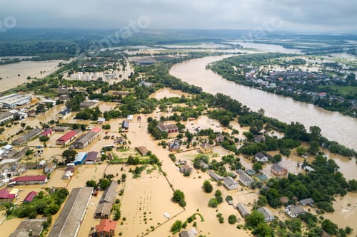 Preview: Aerial view of flooded houses with dirty water of Dnister river in Halych town, western Ukraine