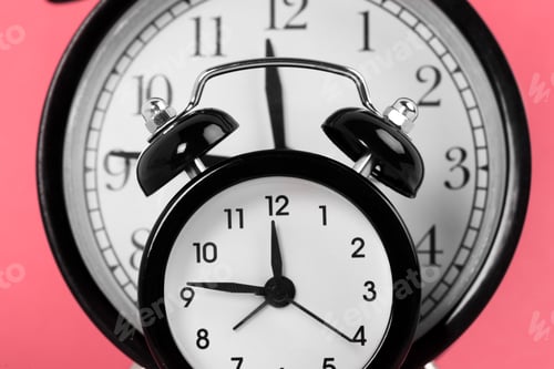 Preview: Vintage alarm clock on a bright pink background