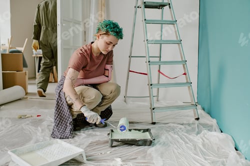 Preview: Woman Painting Wall during Home Renovation and Moving Process