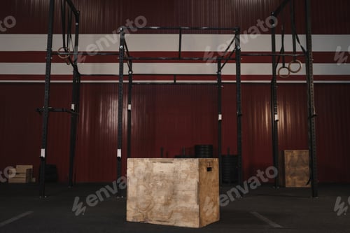 Preview: Crossfit gym with workout equipment. Box jumps horizontal bars, gymnastic rings