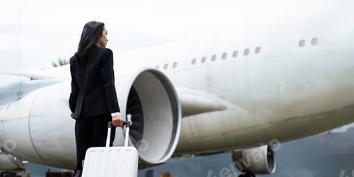 Preview: Professional Asian business woman executive wearing suit walking in the airport looking away