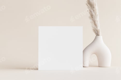 Preview: Square invitation card mockup with a pampas decoration on the soft yellow background.