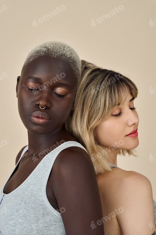 Preview: Two diverse young girls bonding with eyes closed isolated on beige background.