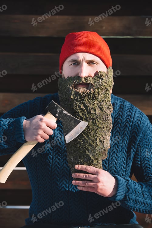 Preview: portrait of man with beard made of wood bark and axe in hand outdoors