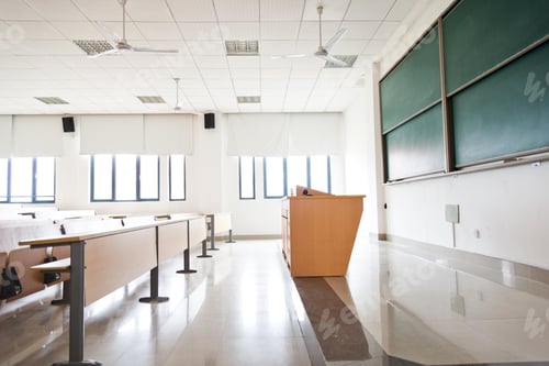 Preview: Empty Classroom with Desks and Chalkboard