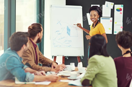 Preview: Cropped shot of a young creative giving a presentation to her colleagues in an office