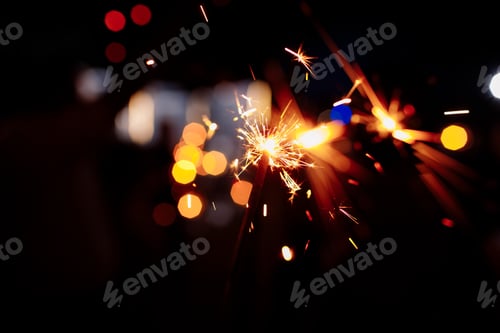 Preview: Festive background, bengal light on the dark background, New Year with sparklers sparks on a festive