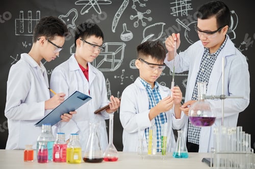 Preview: Students and teacher conducting experiment