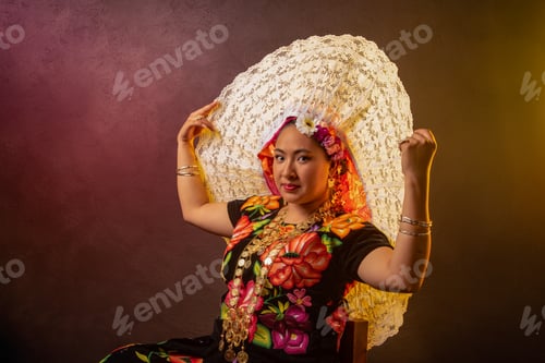 Preview: A woman wearing a flowery dress and a large white hat
