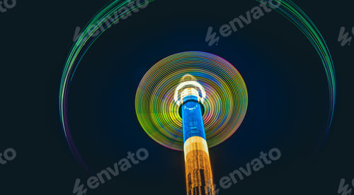 Preview: Colorful abstract traces of high whirling carousel on black background