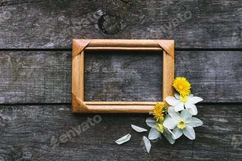 Preview: Spring flowers and frame on a old wooden background