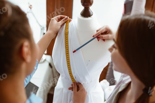 Preview: Close-up of taking measurements for new dress
