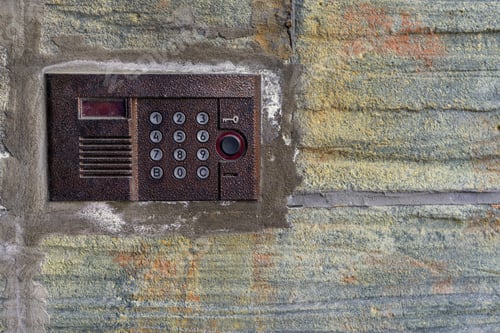Preview: One Panel Management Of The Old On-Door Speakerphone On An Old Concrete Wall Closeup