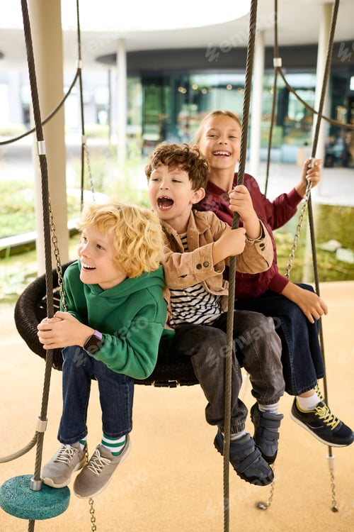 Preview: Joyful moments of childhood happiness on swings during a vibrant autumn day outdoors