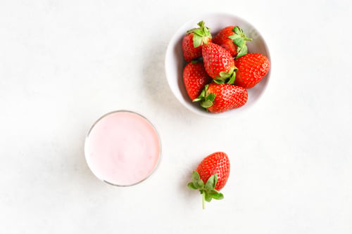 Preview: Fresh Strawberries and Pink Yogurt on White Background