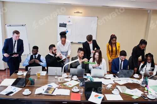Preview: Multiracial young creative people in modern office