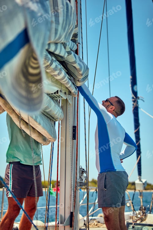 Preview: Sailor Packing / Unpacking Main Sail Wing On The Boat.