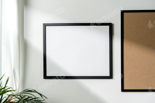 Preview: Blank picture frames on the white wall copy space