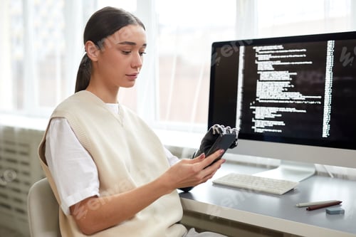 Preview: Woman working with software on mobile phone