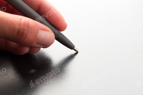 Preview: Man holding pen close up