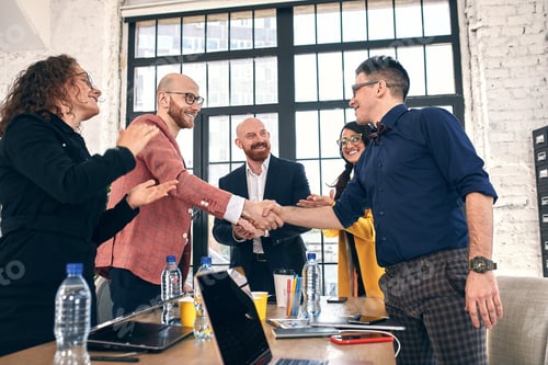 Preview: Business handshake at meeting or negotiation in the office. Partners are satisfied because signing
