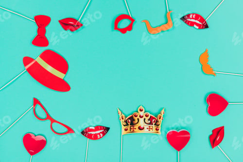Preview: top view of frame made of holiday masks and decorations, isolated on turquoise