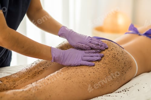 Preview: Closeup of a woman getting a whole-body relaxing scrub massage done in a spa