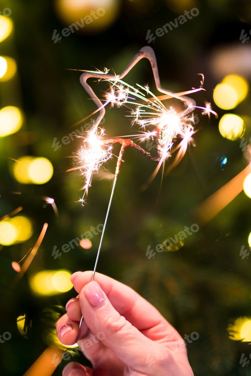 Preview: Woman holding sparklers