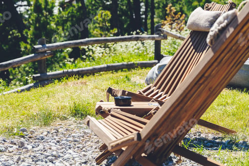 Preview: Two wooden chairs with mountain view at mountain resort in Swizzera. Vacation and trip concept.