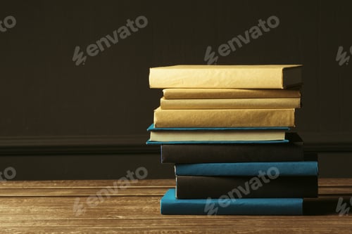 Preview: Books close up on old wooden table
