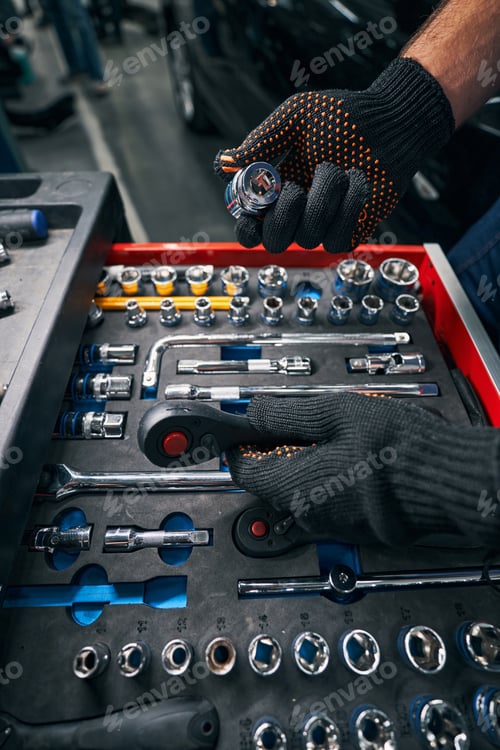 Preview: Technician holding socket wrench and head in hands