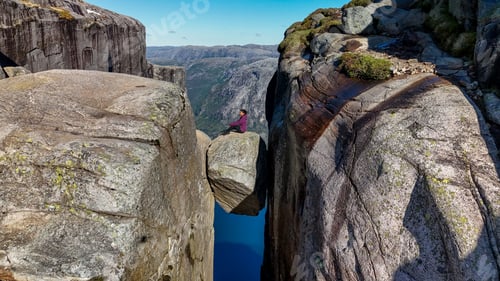 Preview: Adventurous Soul Balancing on Rock in Norway's Stunning Lysefjord