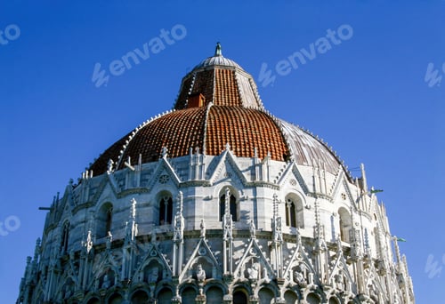 Preview: Baptistery of pisa dome showing its red roof tiles and white marble decorations
