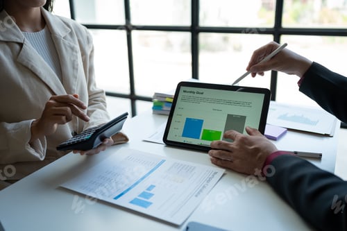 Preview: business team meeting Discuss strategy planning and calculating revenue performance with a new proje