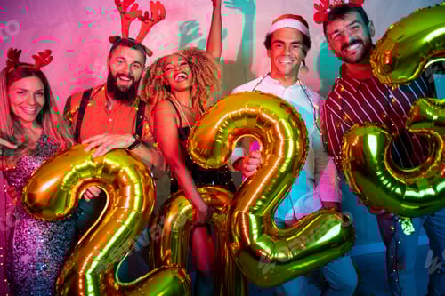Preview: Friends holding giant balloons shaped as numbers 2023 representing the upcoming New Year