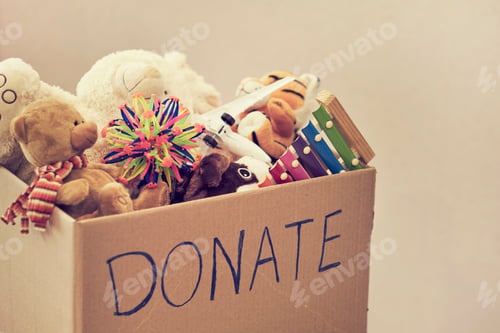 Preview: Donation box with children toys. woman collects toys for charity.