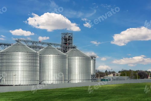 Preview: Scenic view of big modern steel agricultural grain granary silos cereal bin storage warehouse