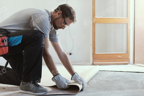 Preview: Contractor removing an old linoleum flooring